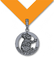 Image of the Silver Koala medallion, featuring an engraved Koala in a silver circle with the words "Scouts Australia" on it. 